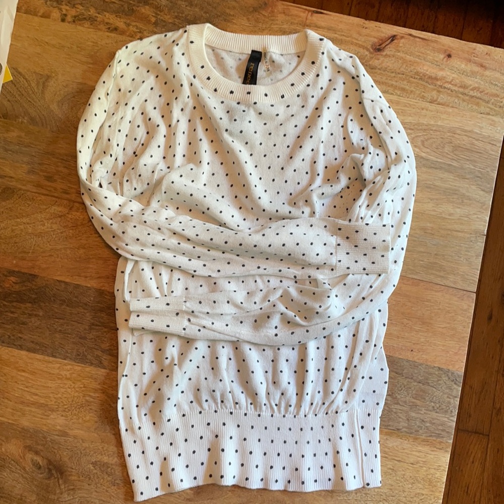 White sweater with black polka dots